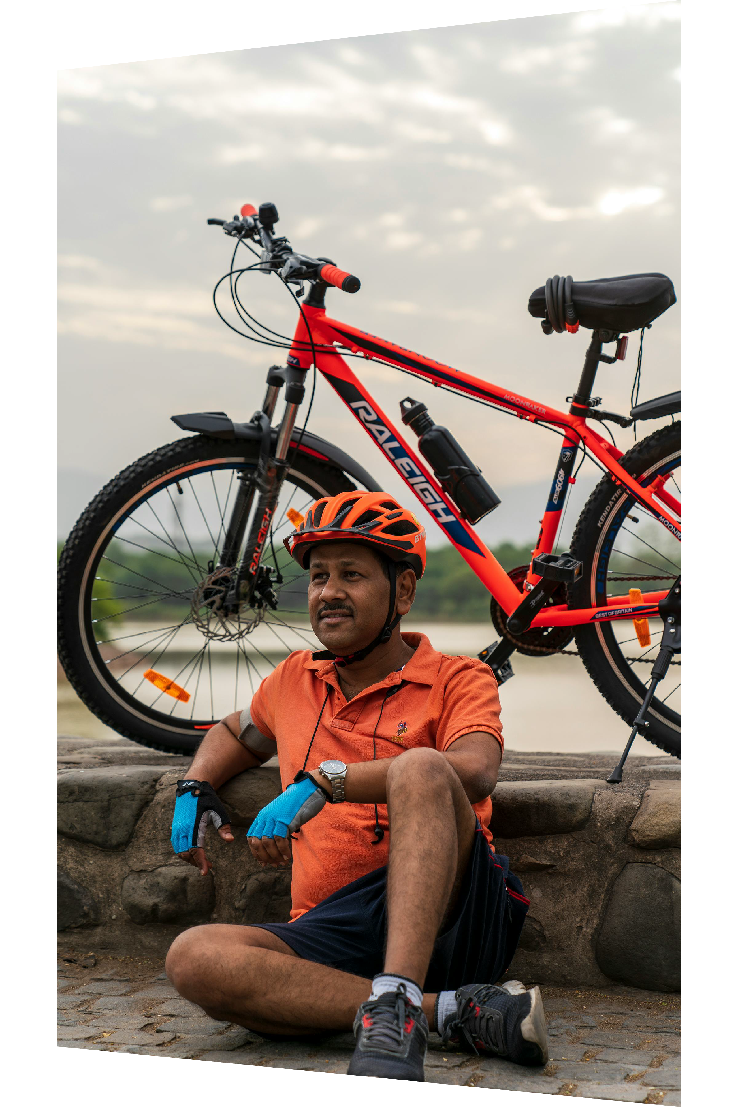 Person sitting next to bike